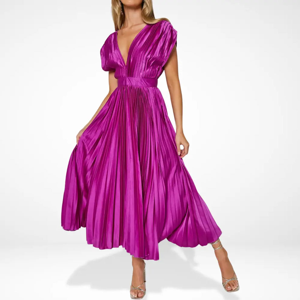 Long pleated dress with deep neckline and elegant styling