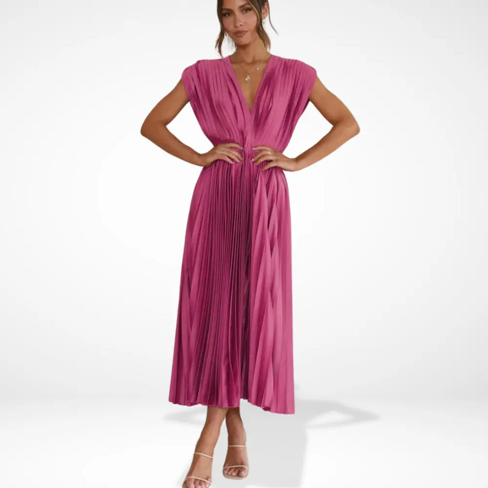 Long pleated dress with deep neckline and elegant styling