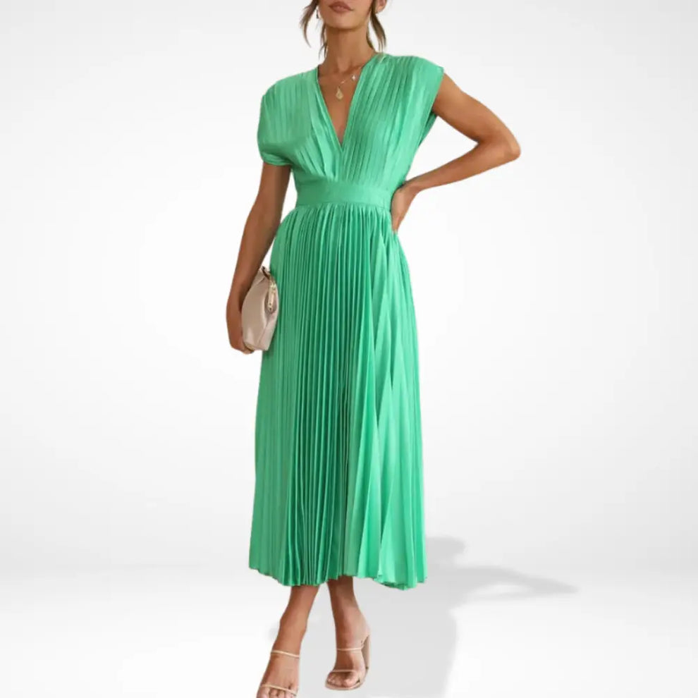 Long pleated dress with deep neckline and elegant styling