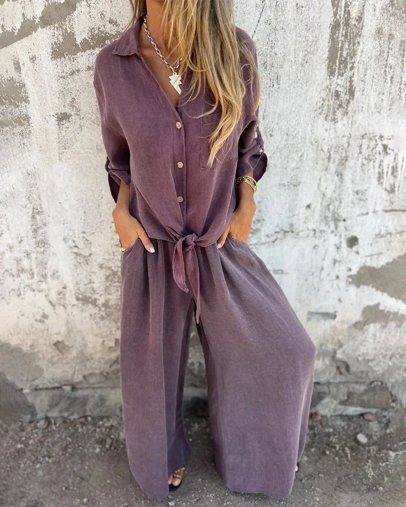Elegant ladies summer outfit with baggy pants and long-sleeved button-up blouse