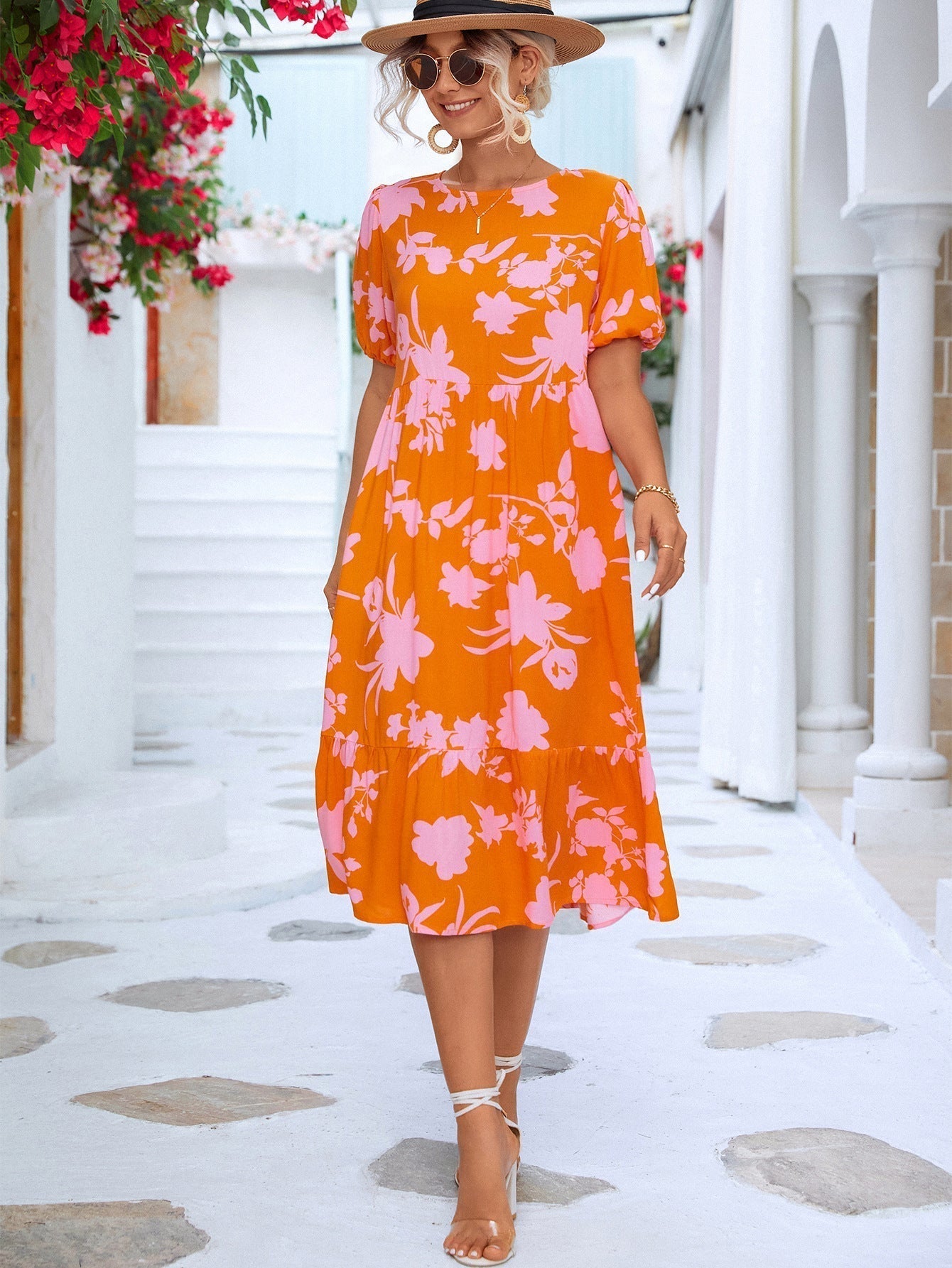 Floral midi dress with puff sleeves and ruffles at the hemline