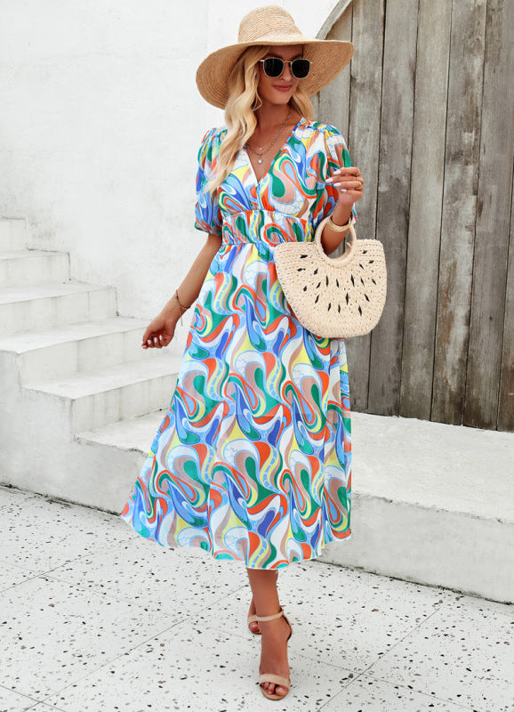 Elegant long dress with V-neck and subtle print