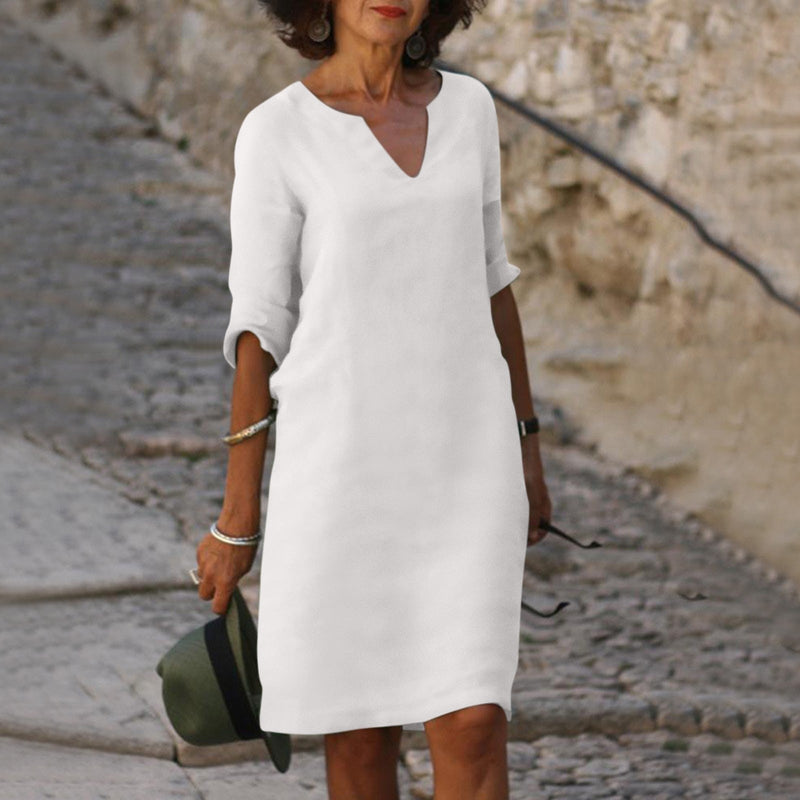 Elegant classic knee-length dress with three-quarter sleeves