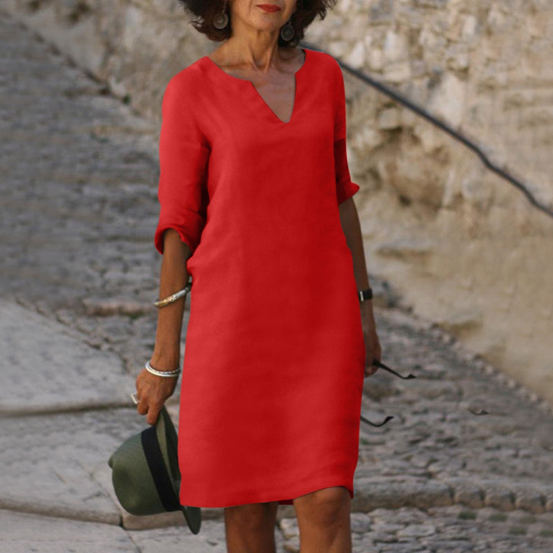 Elegant classic knee-length dress with three-quarter sleeves