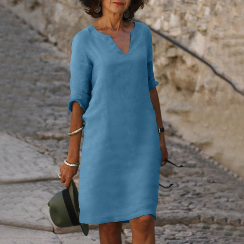 Elegant classic knee-length dress with three-quarter sleeves