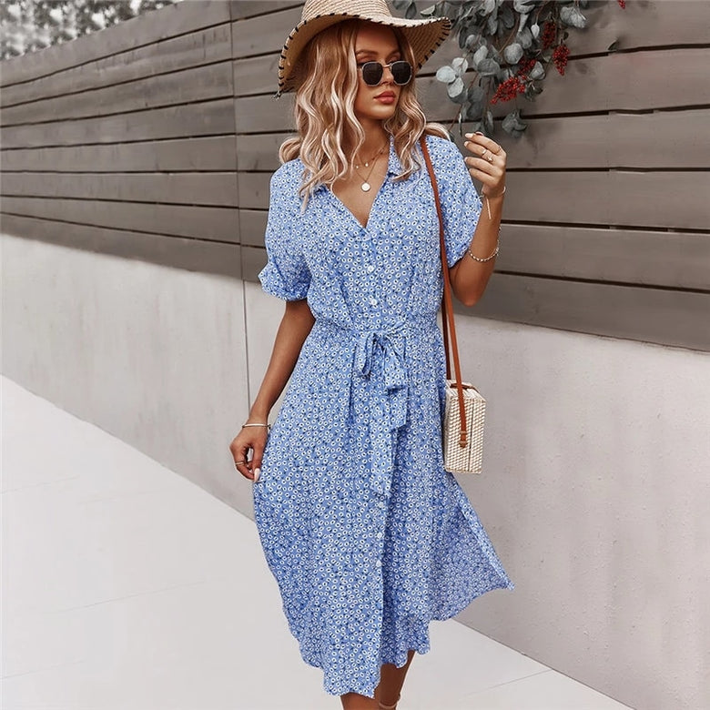 Midi dress with floral print, flowing design and front button closure