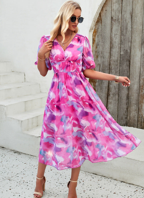 Elegant long dress with V-neck and subtle print