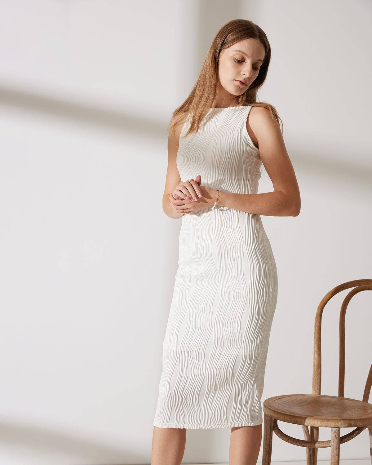 Elegant midi dress with narrow straps in a modern style
