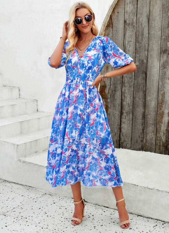 Elegant long dress with V-neck and subtle print