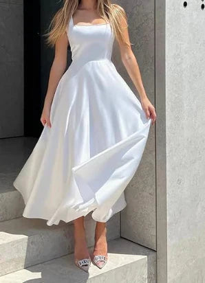 Midi evening dress with straps and wide, elegant skirt