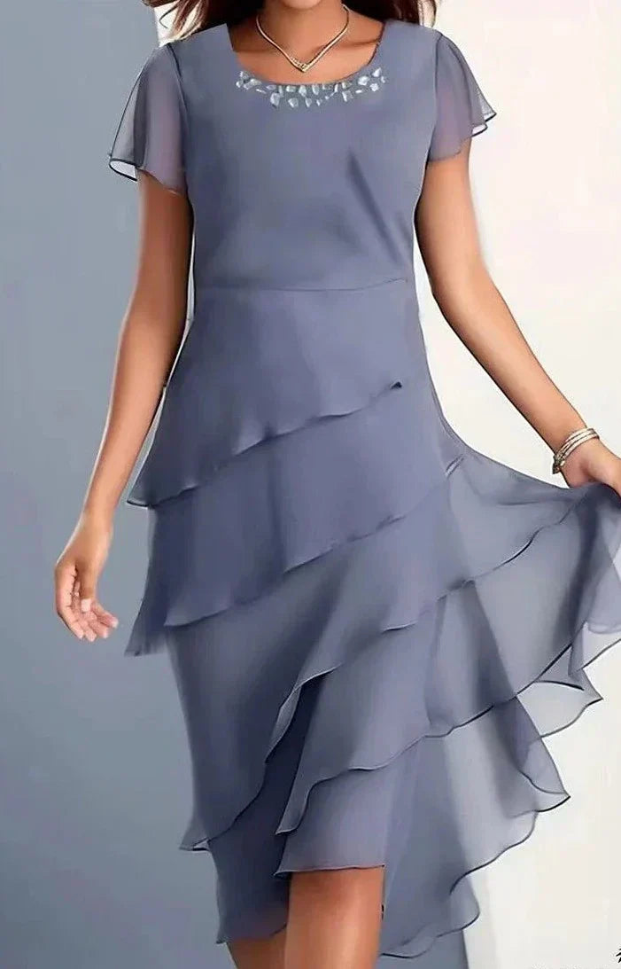Elegant dress with pleats and airiness.