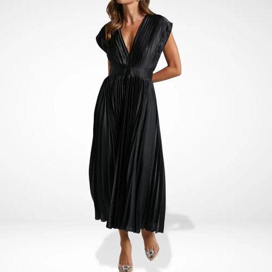 Long pleated dress with deep neckline and elegant styling