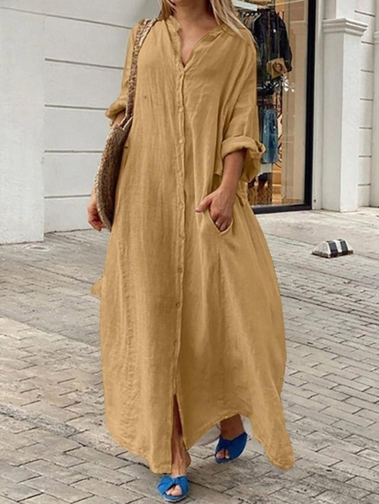 Loose casual one-color pocket dress with one row of buttons and long sleeves