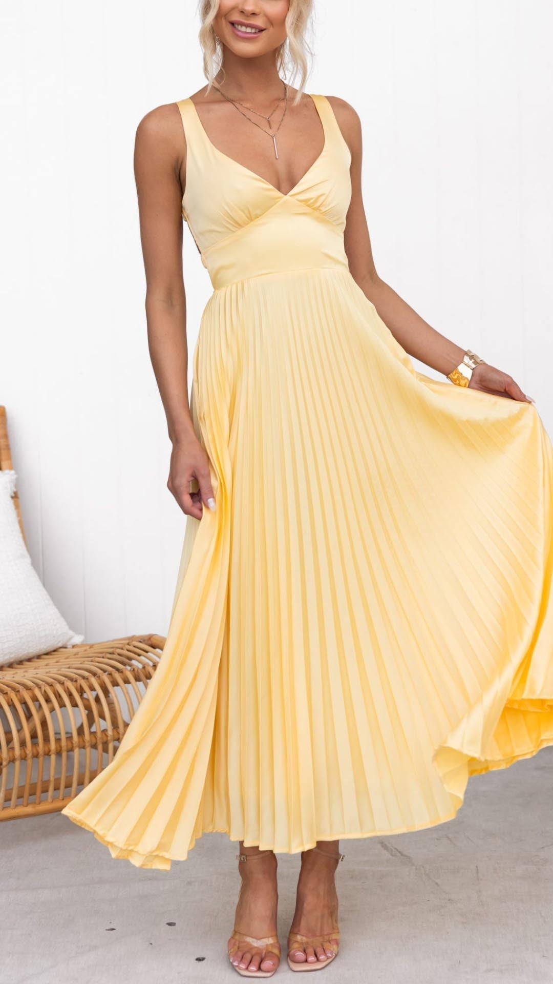 Elegant long party dress with open back and soft pleated skirt