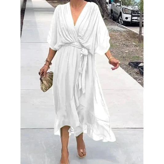 Elegant ladies dress with crossed neckline and flowing drape
