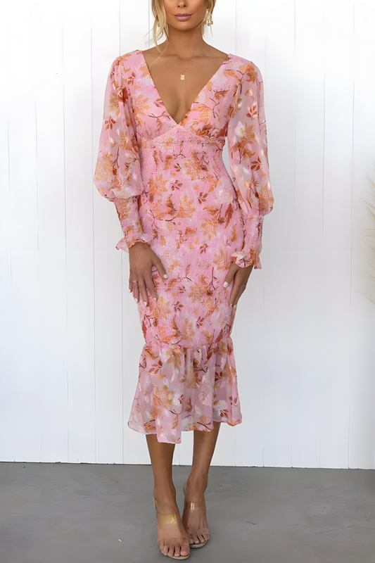 Flowing midi dress with long sleeves and a subtle floral print for an elegant look
