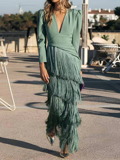Long dress with long sleeves, V-neck and fringe at the hem