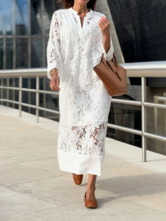 Elegant long dress with long sleeves and a wide cut for special occasions