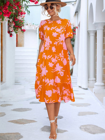 Floral midi dress with puff sleeves and ruffles at the hemline