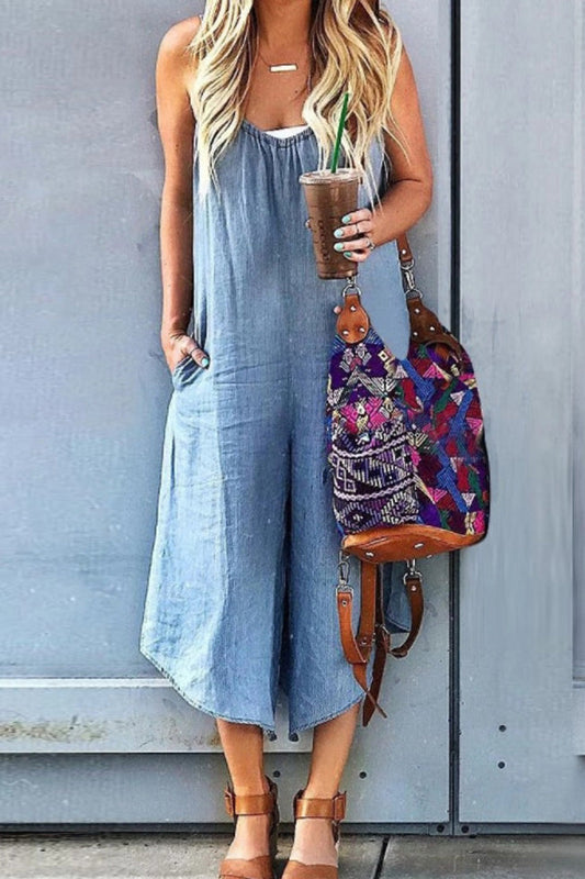Sleeveless denim jumpsuit with V-neck and wide legs
