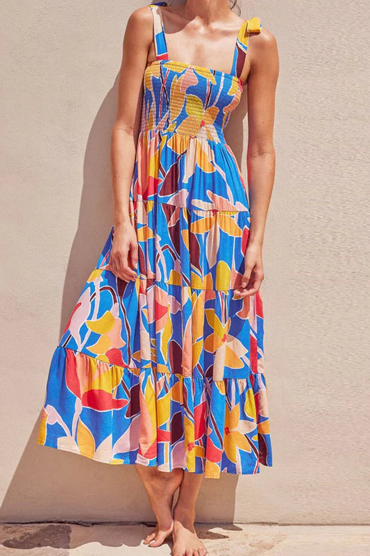 Floral dress with buttoned shoulders and gathered straps