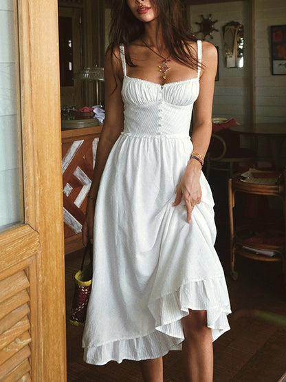 Elegant midi dress with straps and hem with ruffles