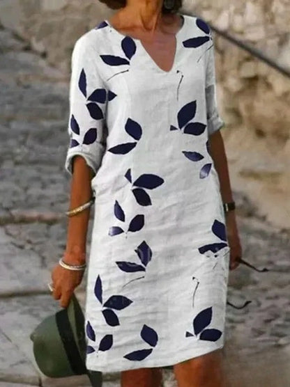 Mc | Basic dress with half sleeves and floral print.