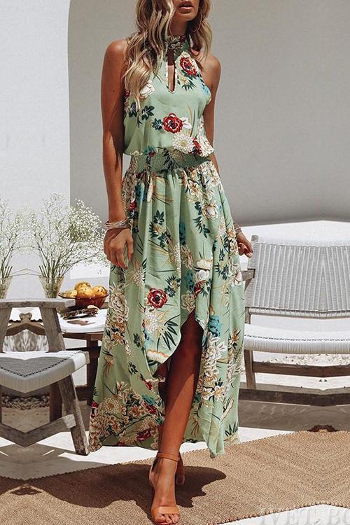 Mc | Green dress with round neckline and floral print.