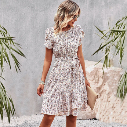 Mc | Floral-patterned dress with ruched hemline.