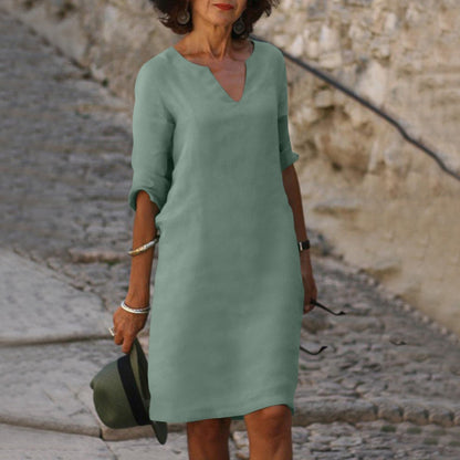 Elegant classic knee-length dress with three-quarter sleeves