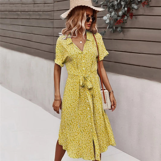 Midi dress with floral print, flowing design and front button closure