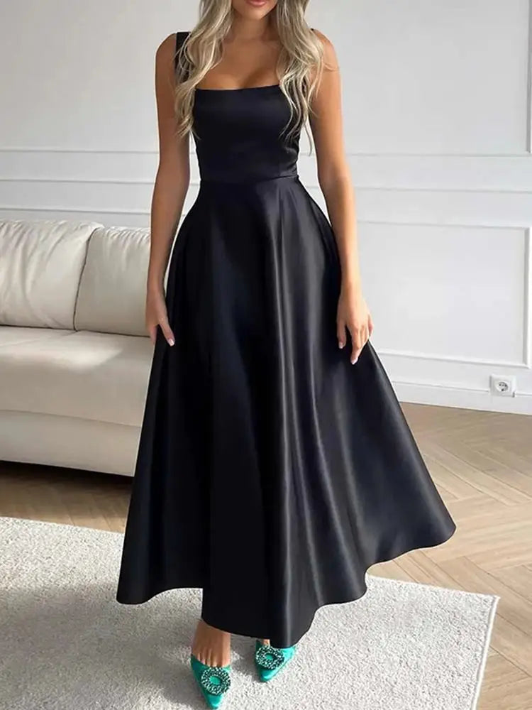 Midi evening dress with straps and wide, elegant skirt