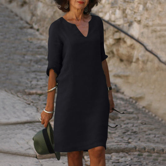 Elegant classic knee-length dress with three-quarter sleeves