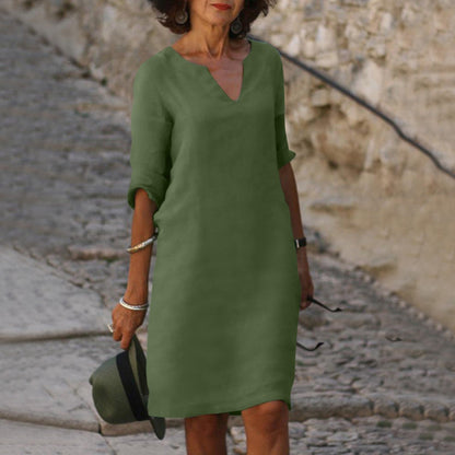 Elegant classic knee-length dress with three-quarter sleeves
