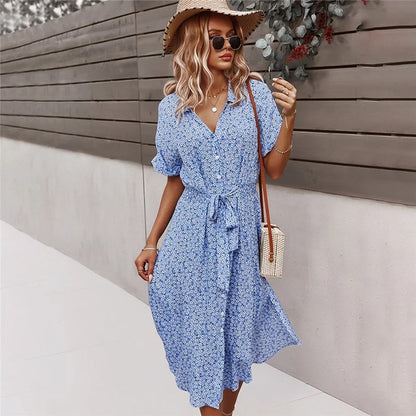 Midi dress with floral print, flowing design and front button closure