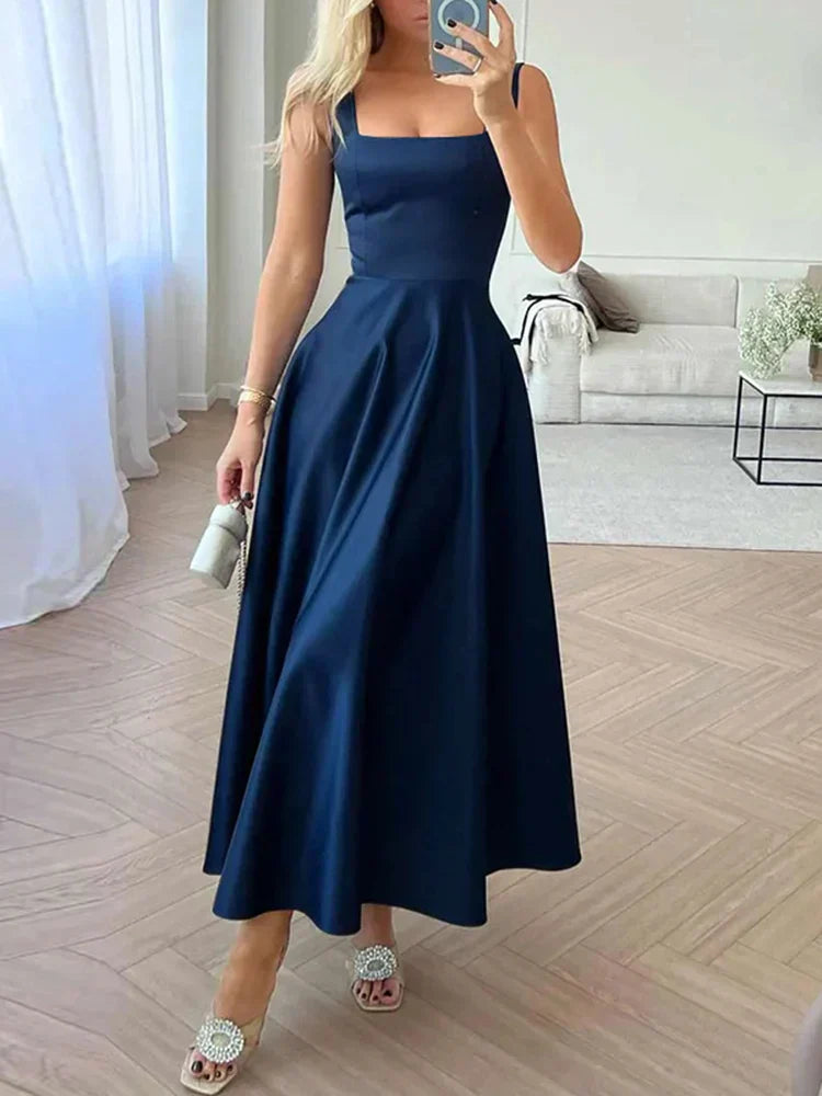 Midi evening dress with straps and wide, elegant skirt