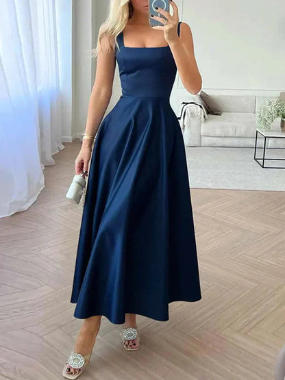 Midi evening dress with straps and wide, elegant skirt