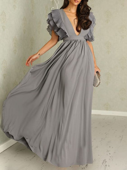 Elegant long dress with a deep neckline and short sleeves with ruffles