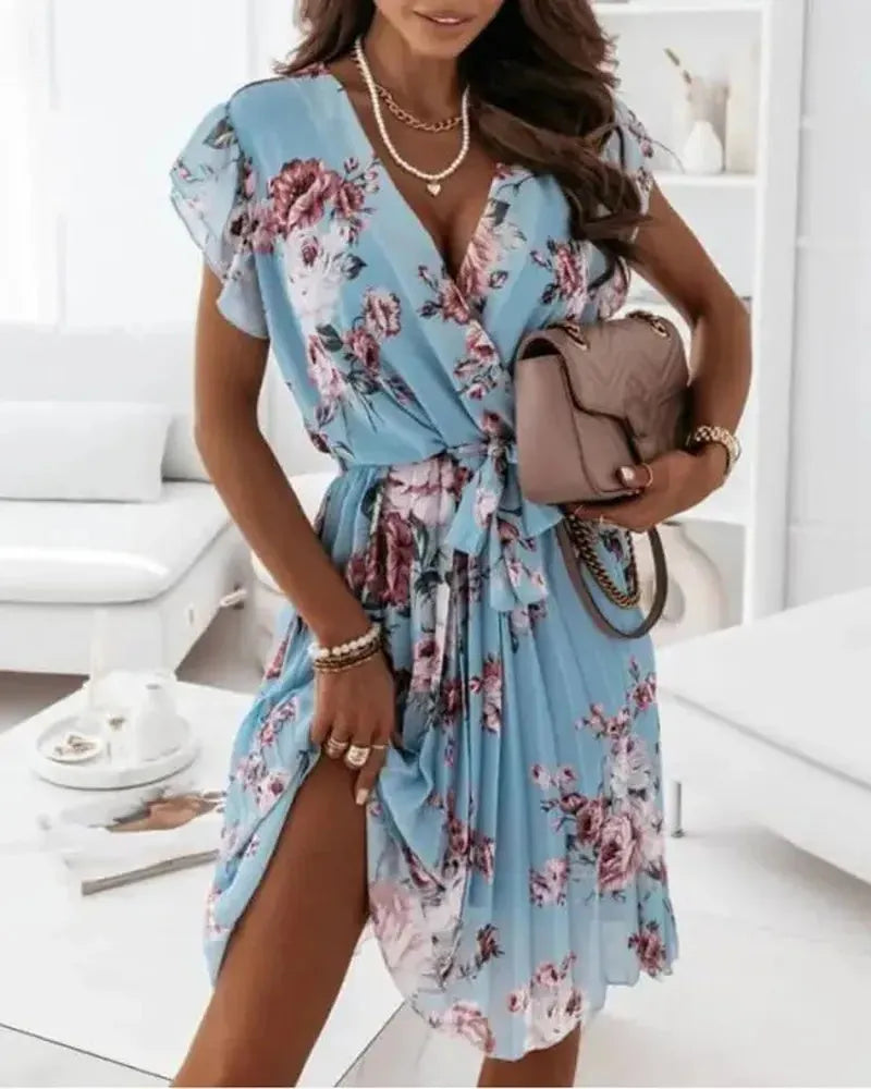 Pleated dress with floral print and belt