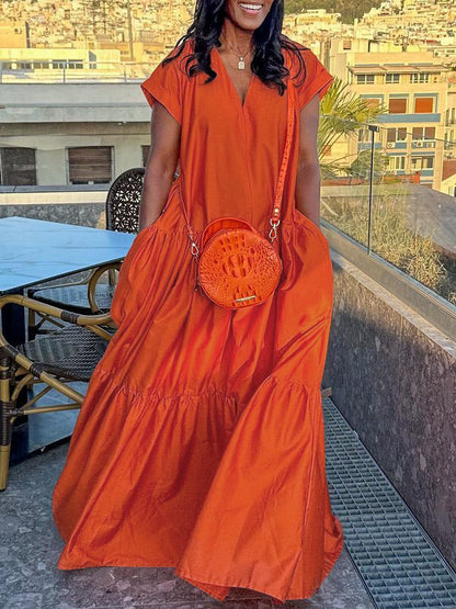 Long flowing dress with V-neck, pleats and slit pockets