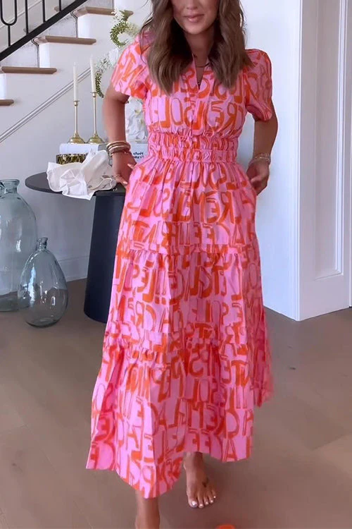 Flared dress with abstract print and ruffles at the waist