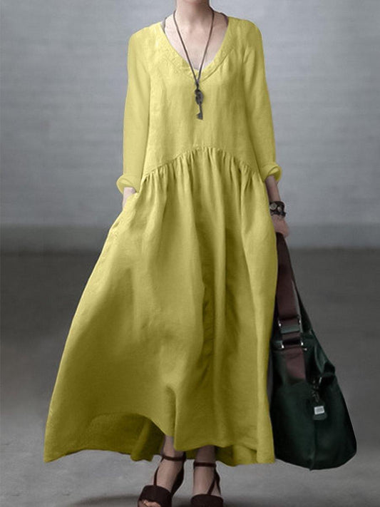 Light, loose dress with a V-neckline and long sleeves