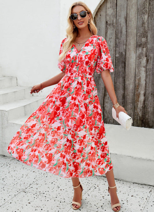Elegant long dress with V-neck and subtle print